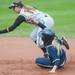 Michigan junior Brandi Virgil is out as she slides in to second base during the forth inning for their game against Iowa at Alumni field Saturday, April 20.
Courtney Sacco I AnnArbor.com